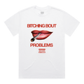 White short-sleeve t-shirt featuring red lips holding a cigarette, with red “Bitching bout” text above, red “problems” text below, and smaller red-and-black “Parental Advisory – Skye Newman” print underneath.