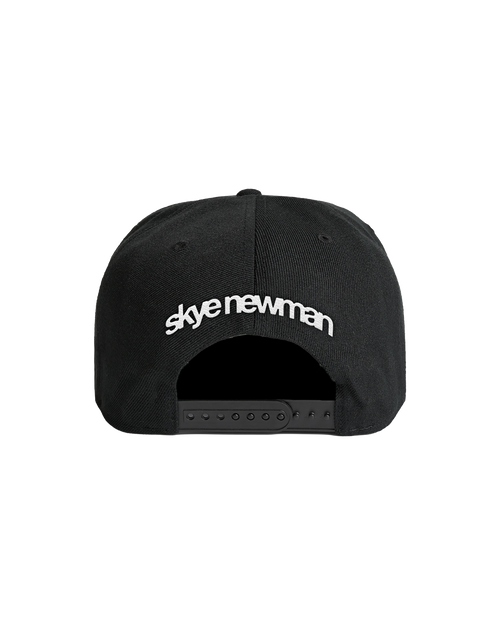 Black cap with 'skye newman' logo embriodered across the back